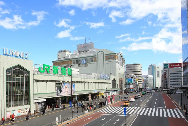 JR Shinjuku Station with the Lumine building above the tracks, seen from the street